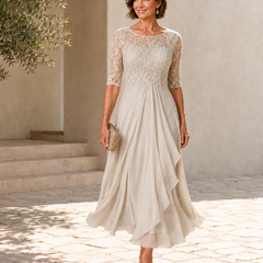 Ivory lace midi dress with 3/4 sleeves, gathered waist and draped layered hem