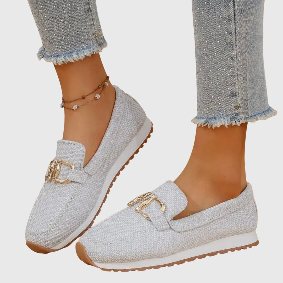 White mesh orthopedic loafers with gold buckle ornament and treaded sole
