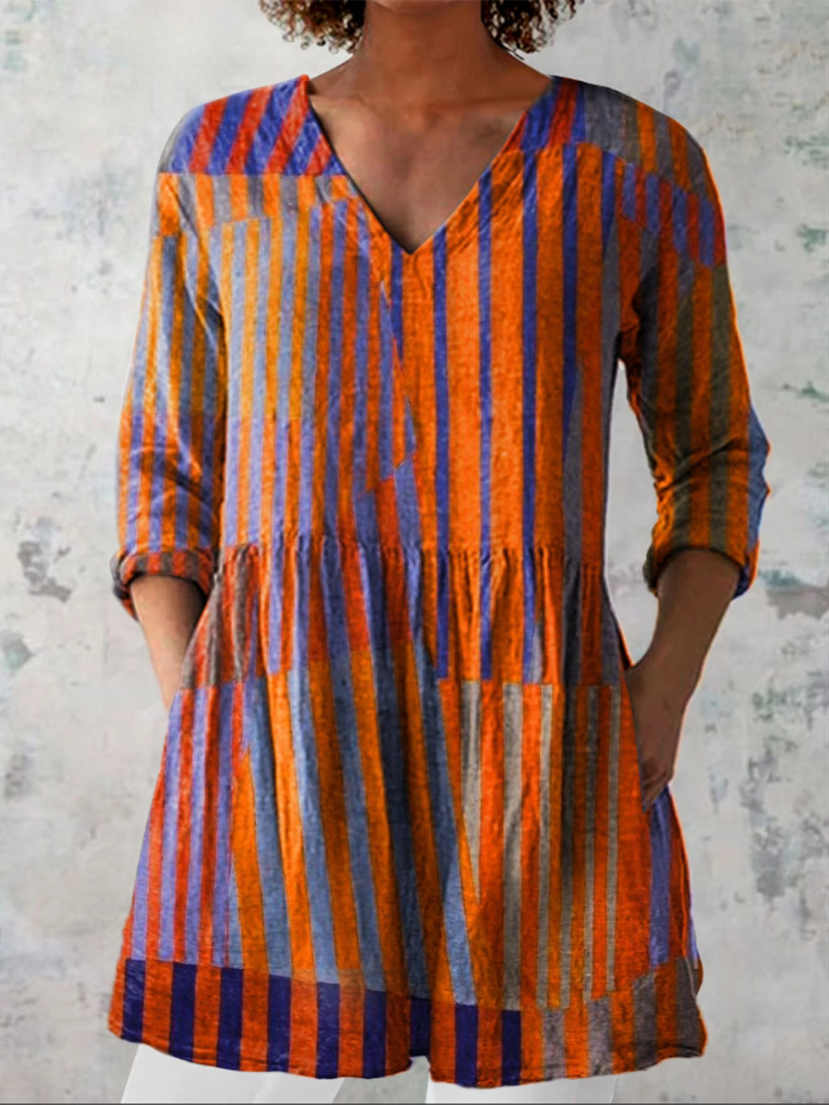 Orange and blue striped long blouse with V-neck, three-quarter sleeves