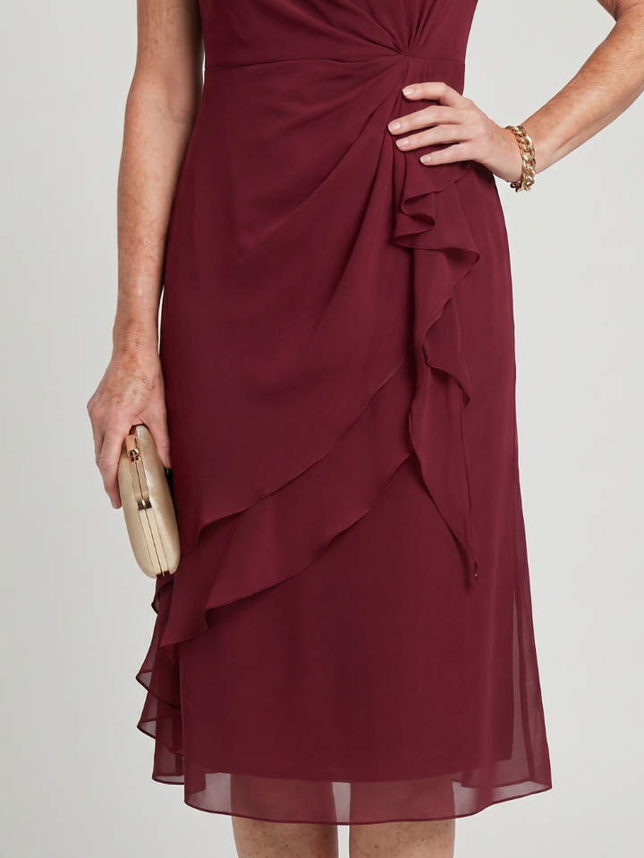 Burgundy midi dress close-up of draped knot front and layered ruffle skirt