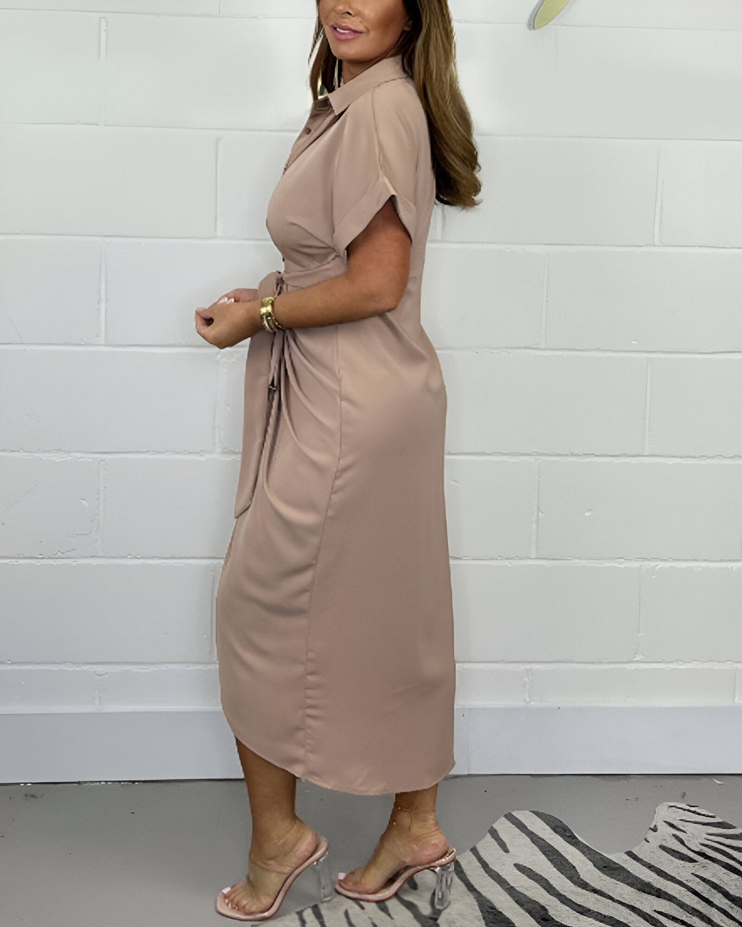 Taupe flared midi dress with V-neck, front tie, and asymmetrical side slit