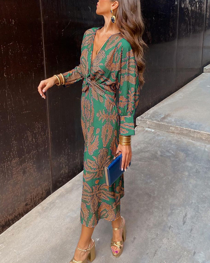 Green patterned midi dress with V-neck, knotted waist tie and long sleeves