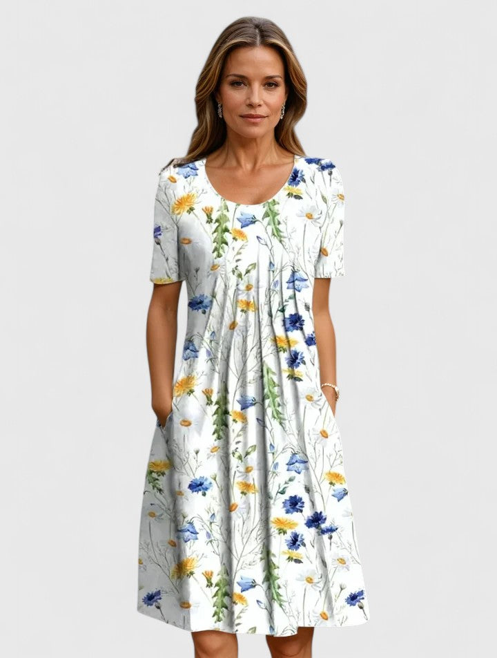 White floral midi dress with short sleeves and gathered skirt