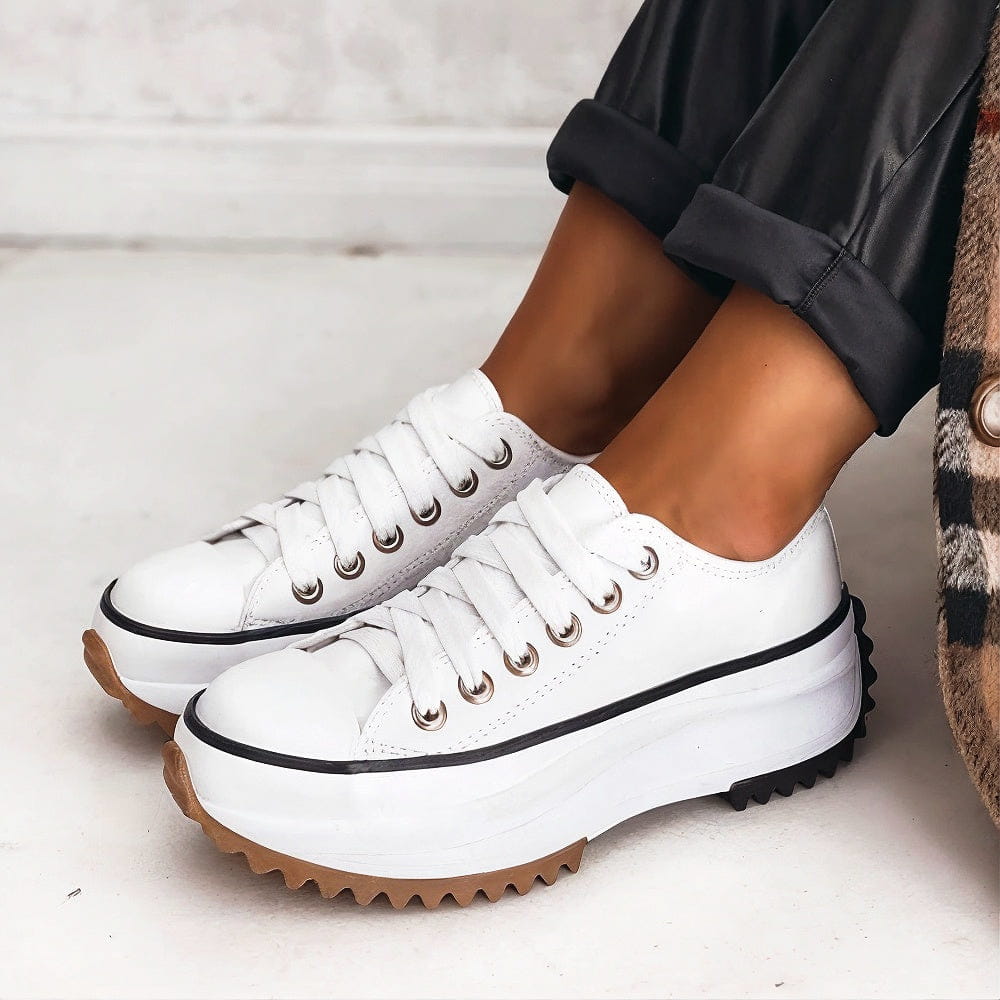 Platform sneakers in white with lace-up eyelets and chunky sole with brown tread