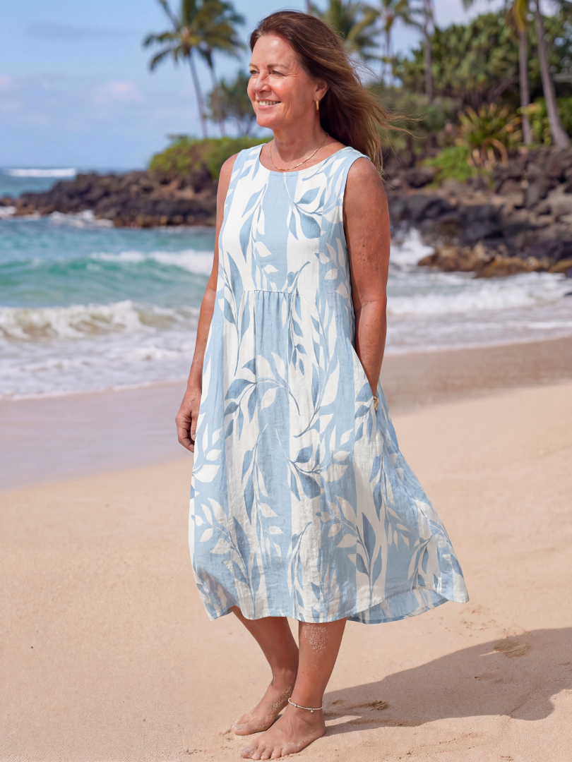 Sky blue leaf print midi dress, sleeveless with flowing skirt and gathered waist seam