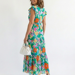 Floral V-neck tiered midi dress, teal base with bright multicolor floral print and tiered skirt