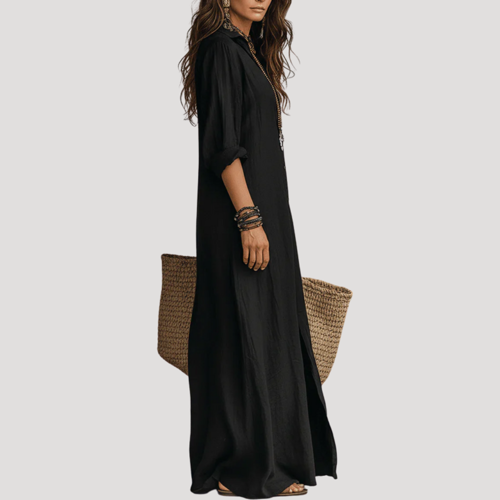 Black maxi shirt dress, front view with button placket and draped side slit