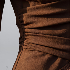Brown satin-like fringe dress close-up, ruched seam lines and gathered fabric