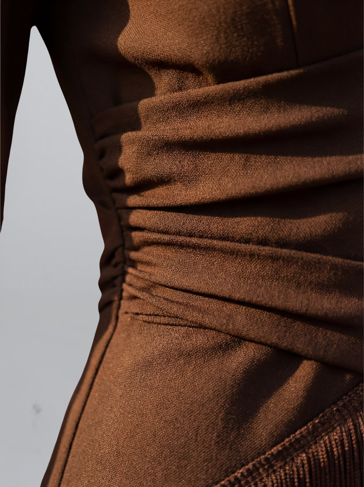 Brown satin-like fringe dress close-up, ruched seam lines and gathered fabric