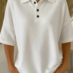 White waffle knit polo blouse with short sleeves, pointed collar, three-button placket