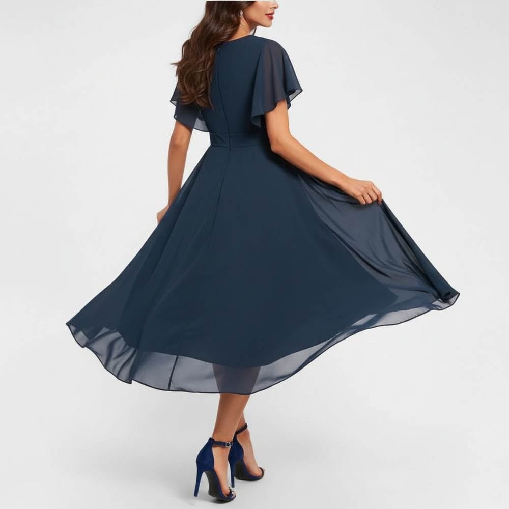 Flowing V-neck maxi dress in dark navy with flutter cap sleeves and full skirt