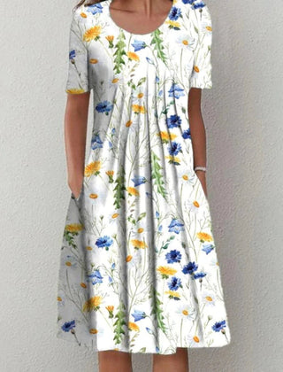 Coverage dress, white base with yellow and blue daisy-like floral print, short sleeves