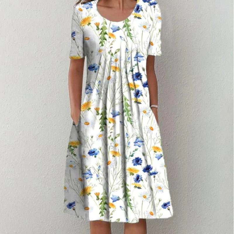 Coverage dress, white base with yellow and blue daisy-like floral print, short sleeves