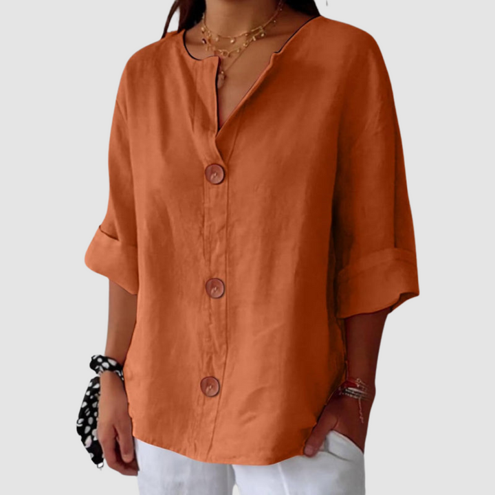 Orange linen blouse with V-neck, button-front closure, and elbow-length sleeves