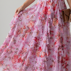 Pink floral maxi dress detail of ruched bodice and tiered, layered ruffle skirt