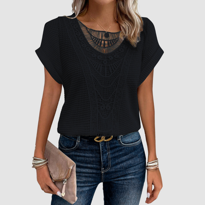 Sophie™ chic lace top in black knit with scalloped lace yoke and short sleeves.