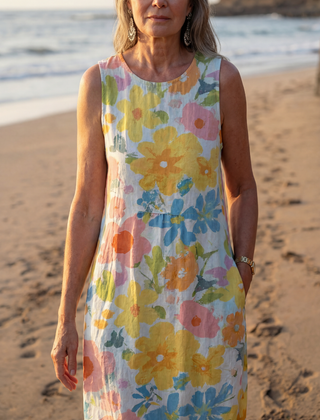 Sleeveless multicolor floral midi dress with round neckline and gathered waist