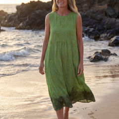 Green sleeveless midi dress with textured floral embroidery and gathered tiered skirt