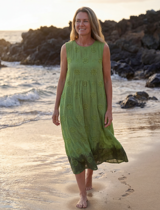 Green sleeveless midi dress with textured floral embroidery and gathered tiered skirt