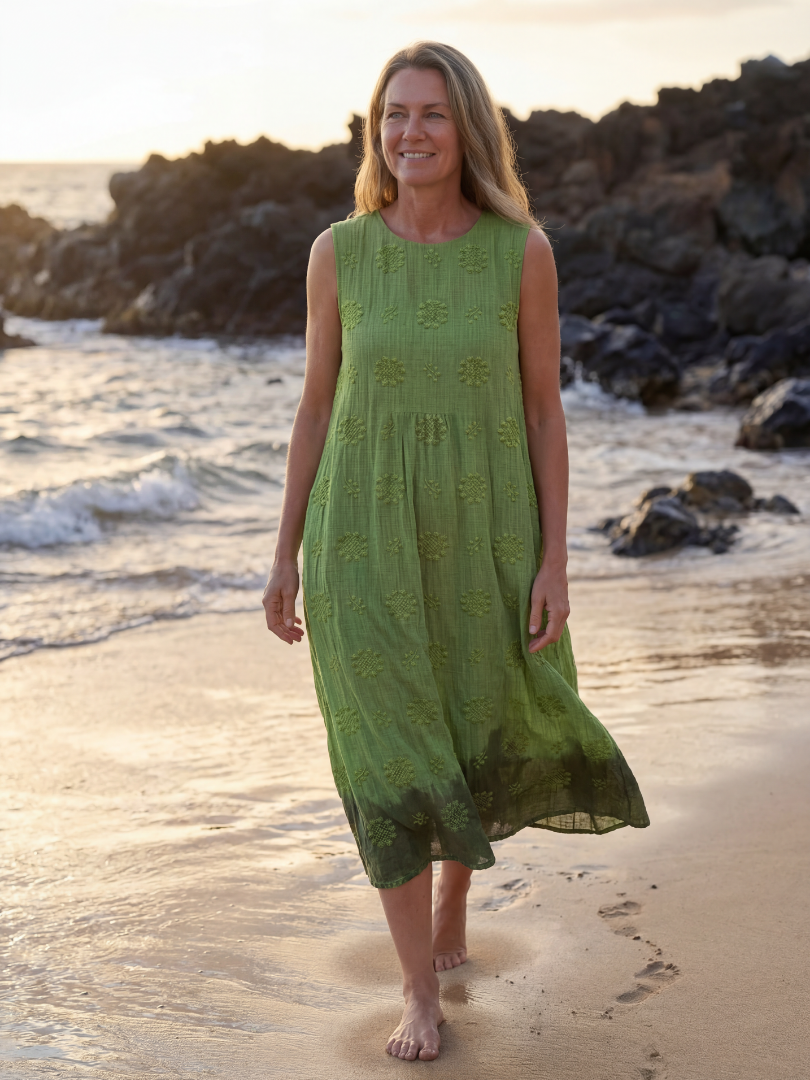Green sleeveless midi dress with textured floral embroidery and gathered tiered skirt