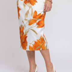 Halter neck floral midi dress, close-up of white fabric with orange floral print