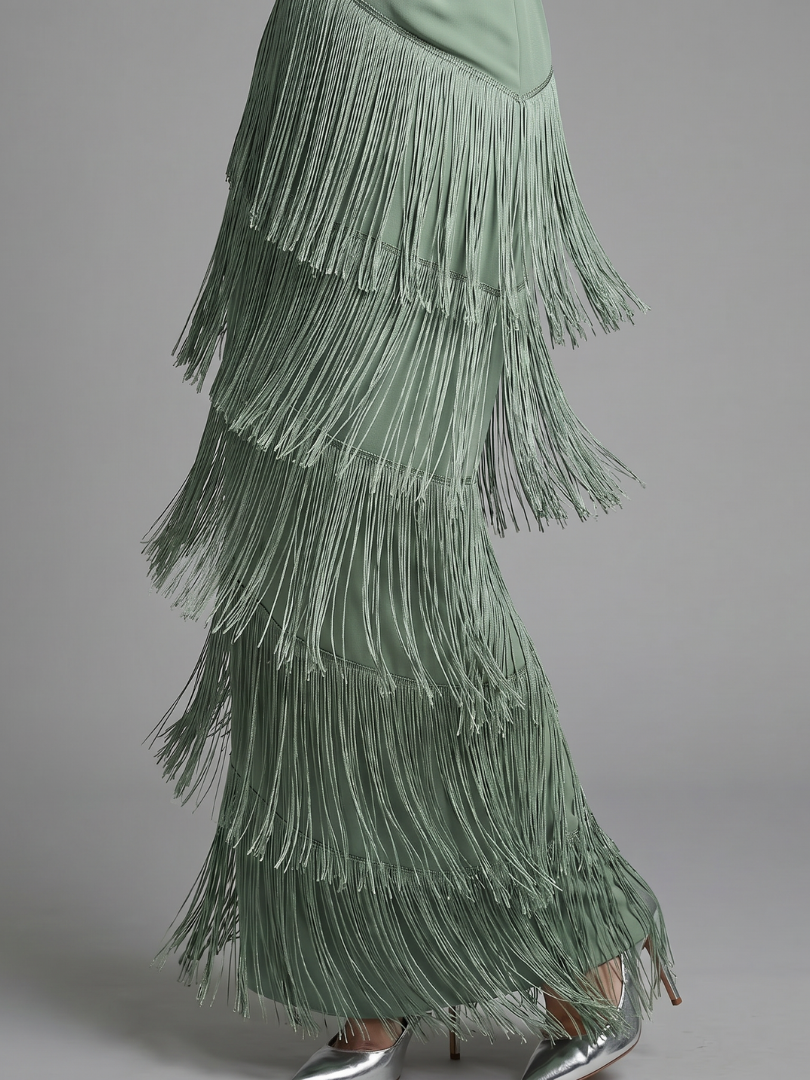 Green tiered midi fringe skirt of tassels on a long-sleeve V-neck dress