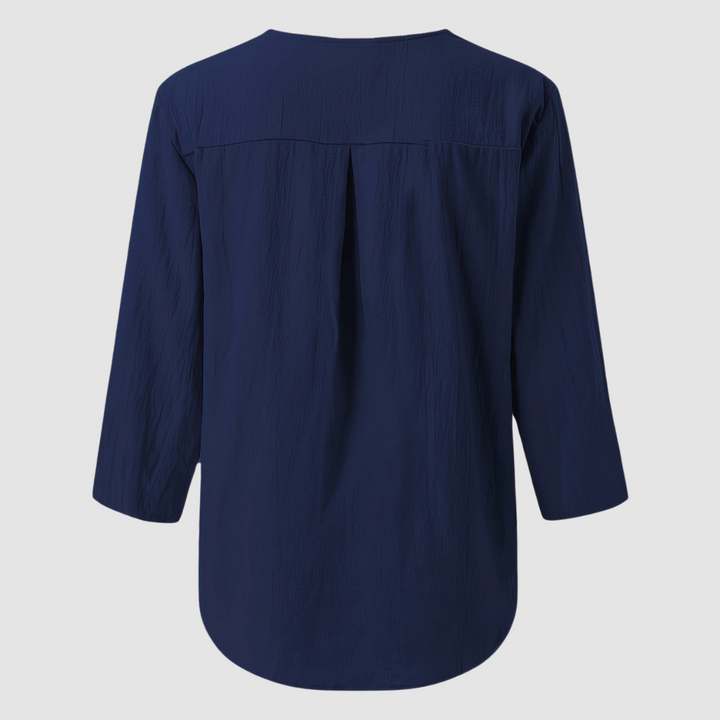 Blue cotton-linen blouse back with yoke pleats and 3/4-length sleeves