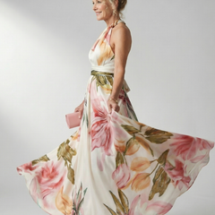 Floral halter maxi dress, cream base with pink rose and green leaf print; flowing skirt