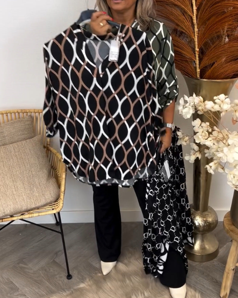 Graphic print blouse, black base with white oval links, button-up V-neck, loose 3/4 sleeves