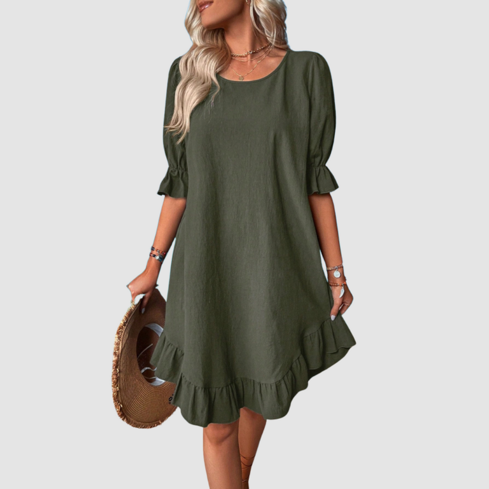 Green flowy summer dress with half sleeves and gathered ruffle hem.