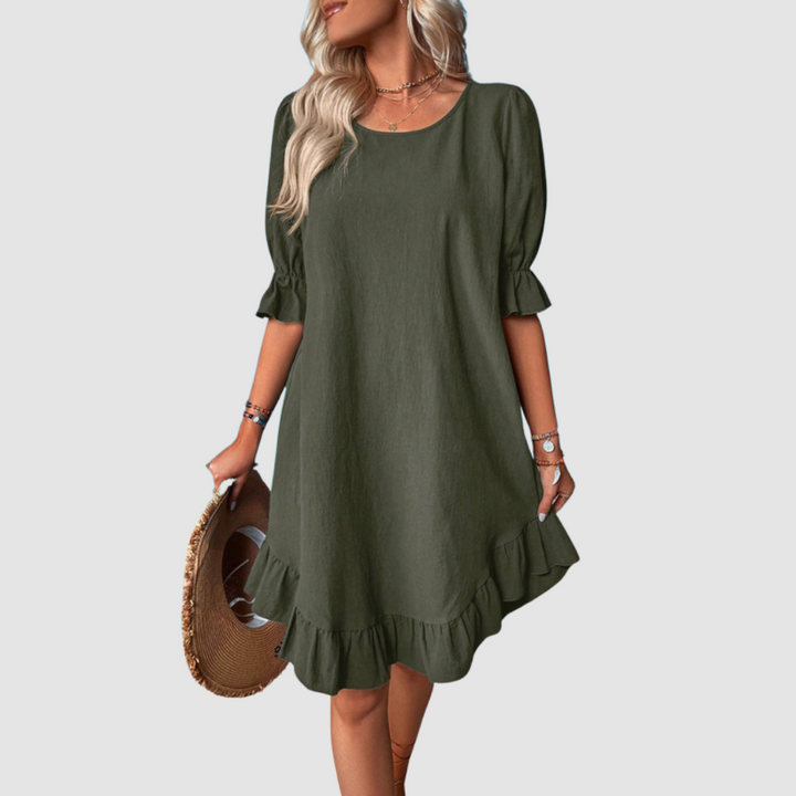 Green flowy summer dress with half sleeves and gathered ruffle hem.