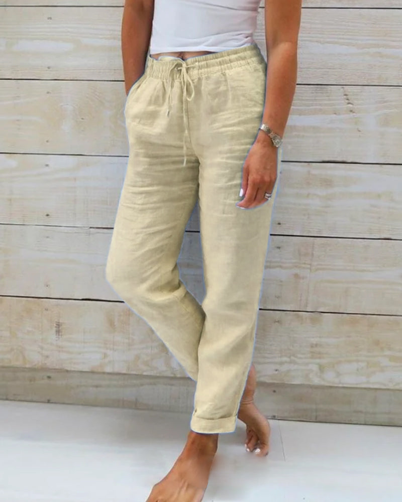 Khaki cotton trousers with drawstring waist and tapered leg cuffs