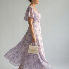 Floral lilac midi dress with flutter sleeves and gathered waist flowing skirt