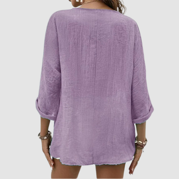 Purple breathable blouse back with center seam and three-quarter sleeves