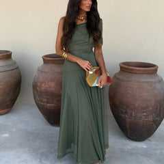 Toledo maxi dress in deep green, off-shoulder design with pleated skirt and draped fabric