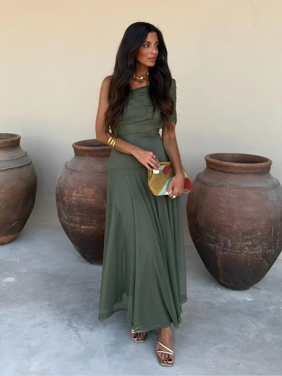 Toledo maxi dress in deep green, off-shoulder design with pleated skirt and draped fabric