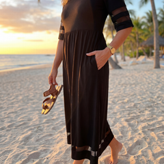 Black midi dress with short sleeves, tiered skirt and side pockets