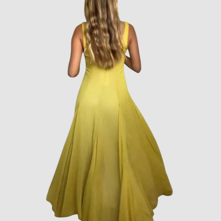 Back view of strappy maxi dress with pleated skirt in yellow