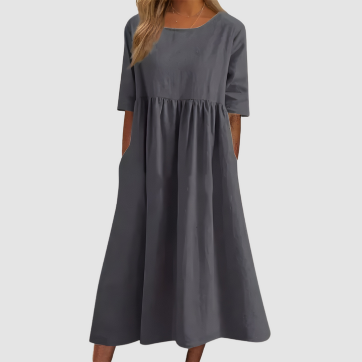 Charcoal gray breezy dress with gathered waist and short sleeves, flowing A-line skirt