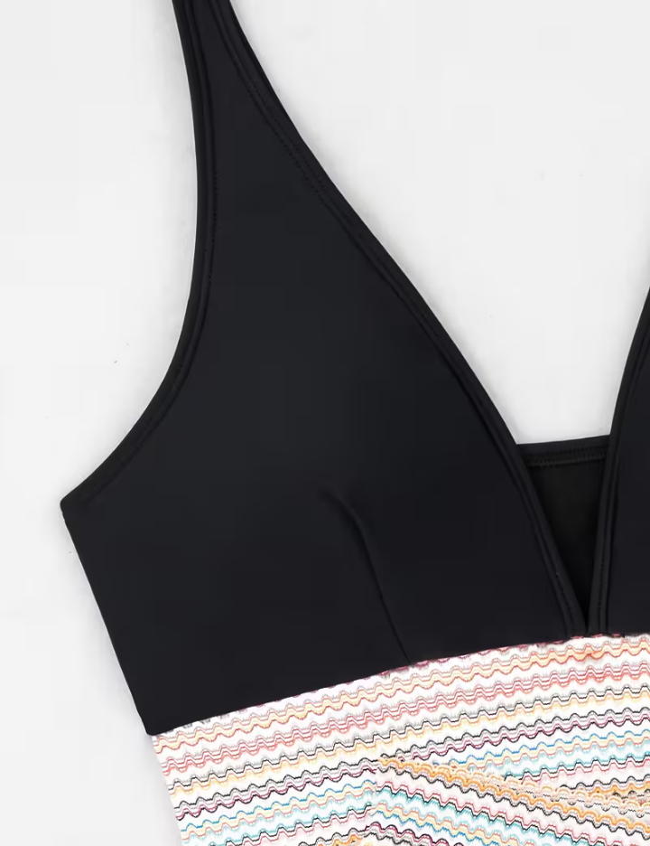 Black triangle bikini top with striped tummy band and deep V neckline