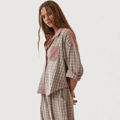 Relaxed pyjama set in pink-and-plaid: side view button shirt and drawstring trousers