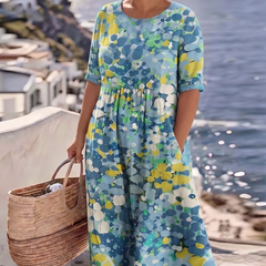 Blue floral midi dress with short sleeves and round neckline, gathered skirt