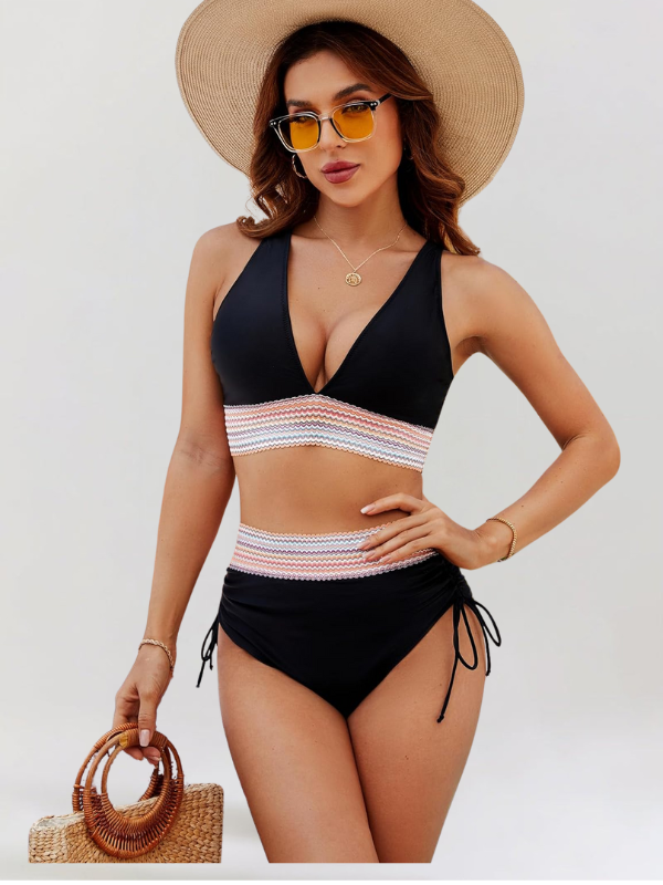 Dark blue-and-black bikini set with V-neck top, striped tummy band, and tie-side bottoms