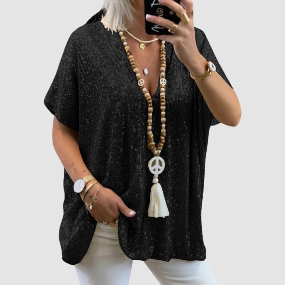 Black V-neck sequin top with short sleeves, relaxed tunic fit.