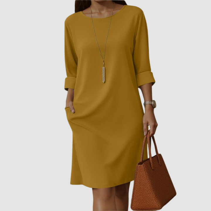 Mustard yellow crew-neck midi dress with 3/4 sleeves and side slit, relaxed.