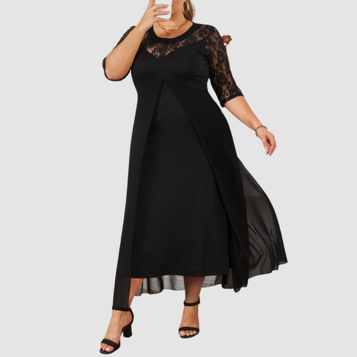 Long lace dress in black with lace sleeves, defined waist, and ankle-length skirt