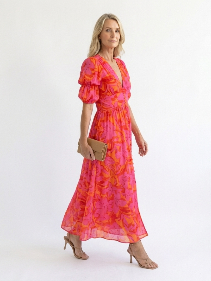 Pink floral V-neck midi dress with puff sleeves and flowing skirt