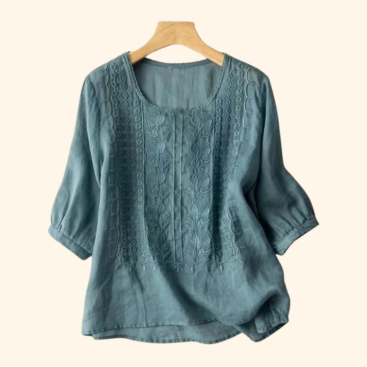 Teal elegant soft blouse with round neck, vertical embroidered front, half sleeves