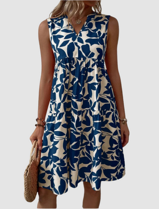 Blue sleeveless V-neck flowy dress with leaf-pattern print and gathered skirt