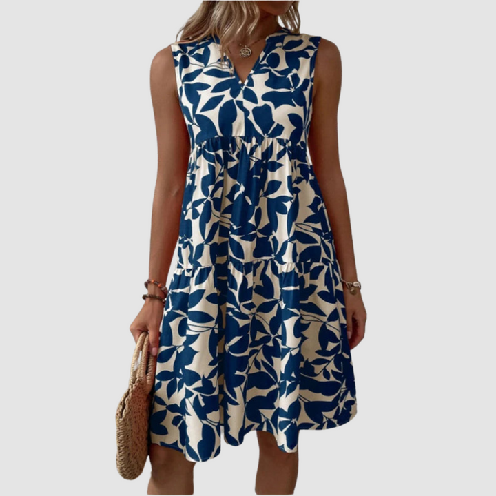 Blue sleeveless V-neck flowy dress with leaf-pattern print and gathered skirt
